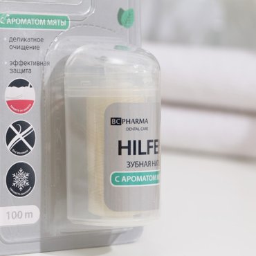 Зубная нить Hilfen вощёная плоская с ароматом мяты 100 м 159₽